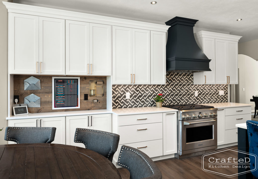 spokane kitchen design with white cabinets black and white patterned tile and command center organization