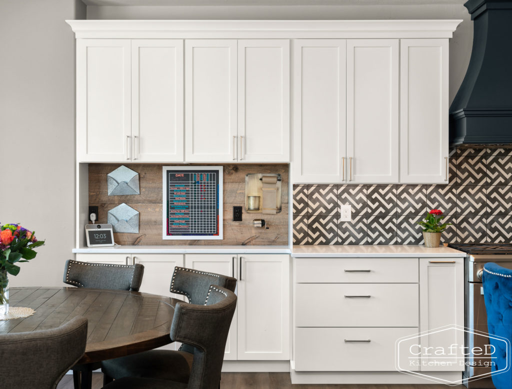 spokane kitchen design with white cabinets black and white patterned tile and command center organization