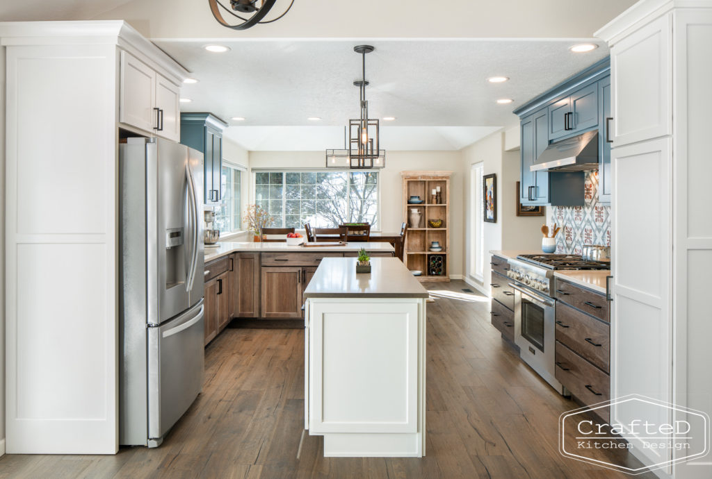 Multi colored kitchen design with blue white and warm wood