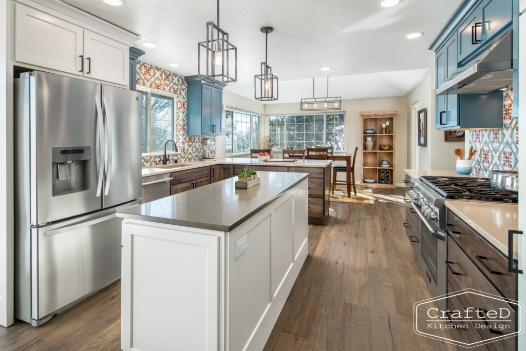 Multi colored kitchen design with blue white warm wood and patterned tile