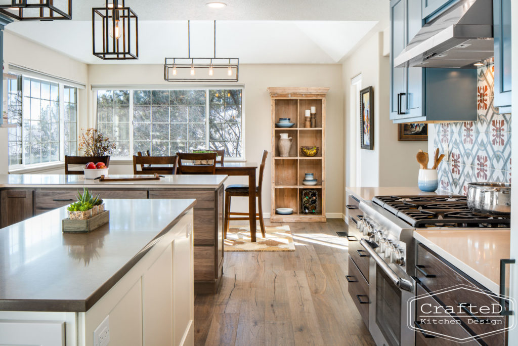 Multi colored kitchen design with blue white warm wood and patterned tile