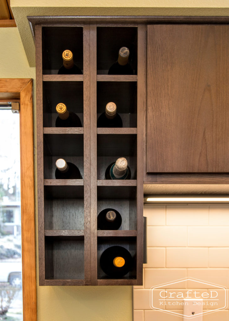 wood cabinet kitchen with wood paneling on ceiling and wine holder