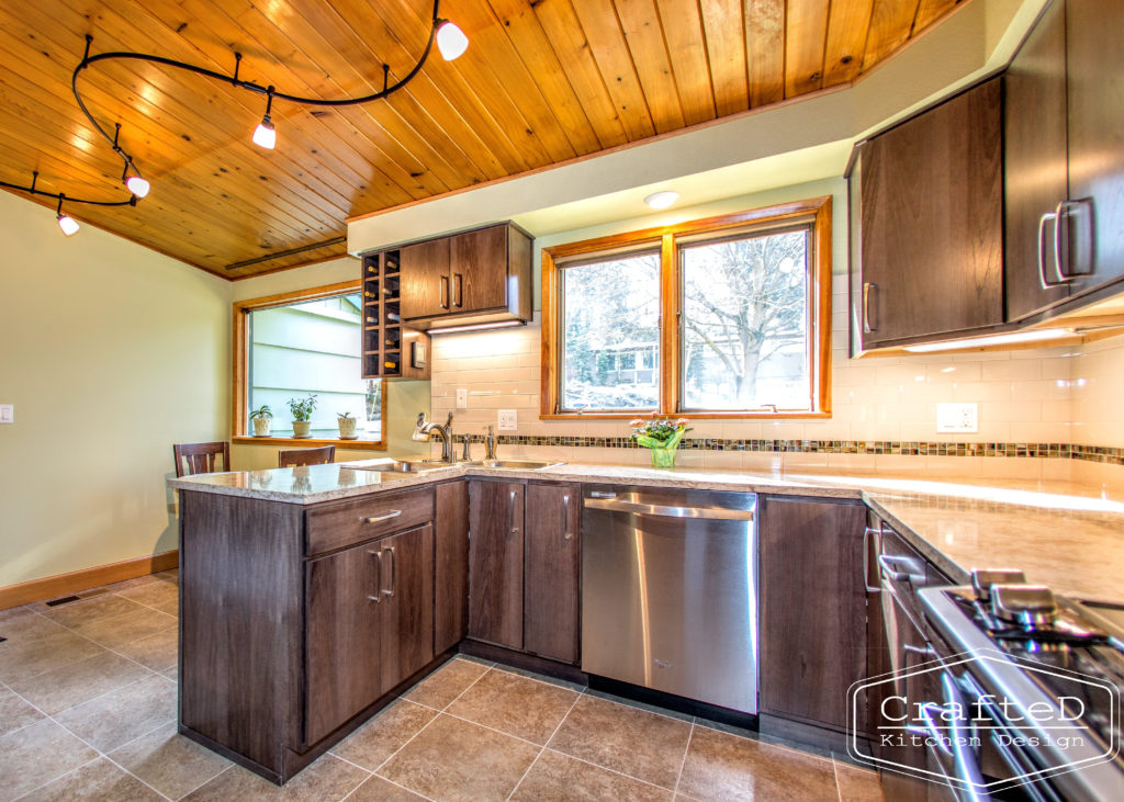 wood cabinet kitchen with wood paneling on ceiling