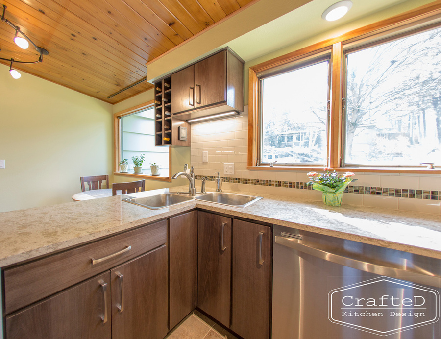 wood cabinet kitchen with wood paneling on ceiling