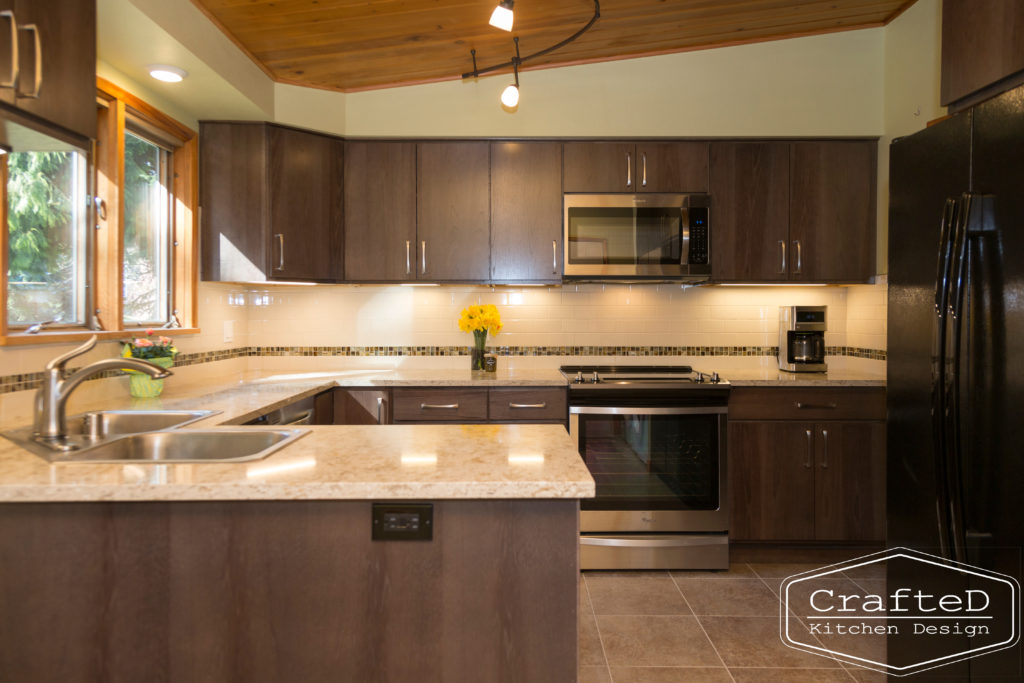 wood cabinet kitchen with wood paneling on ceiling