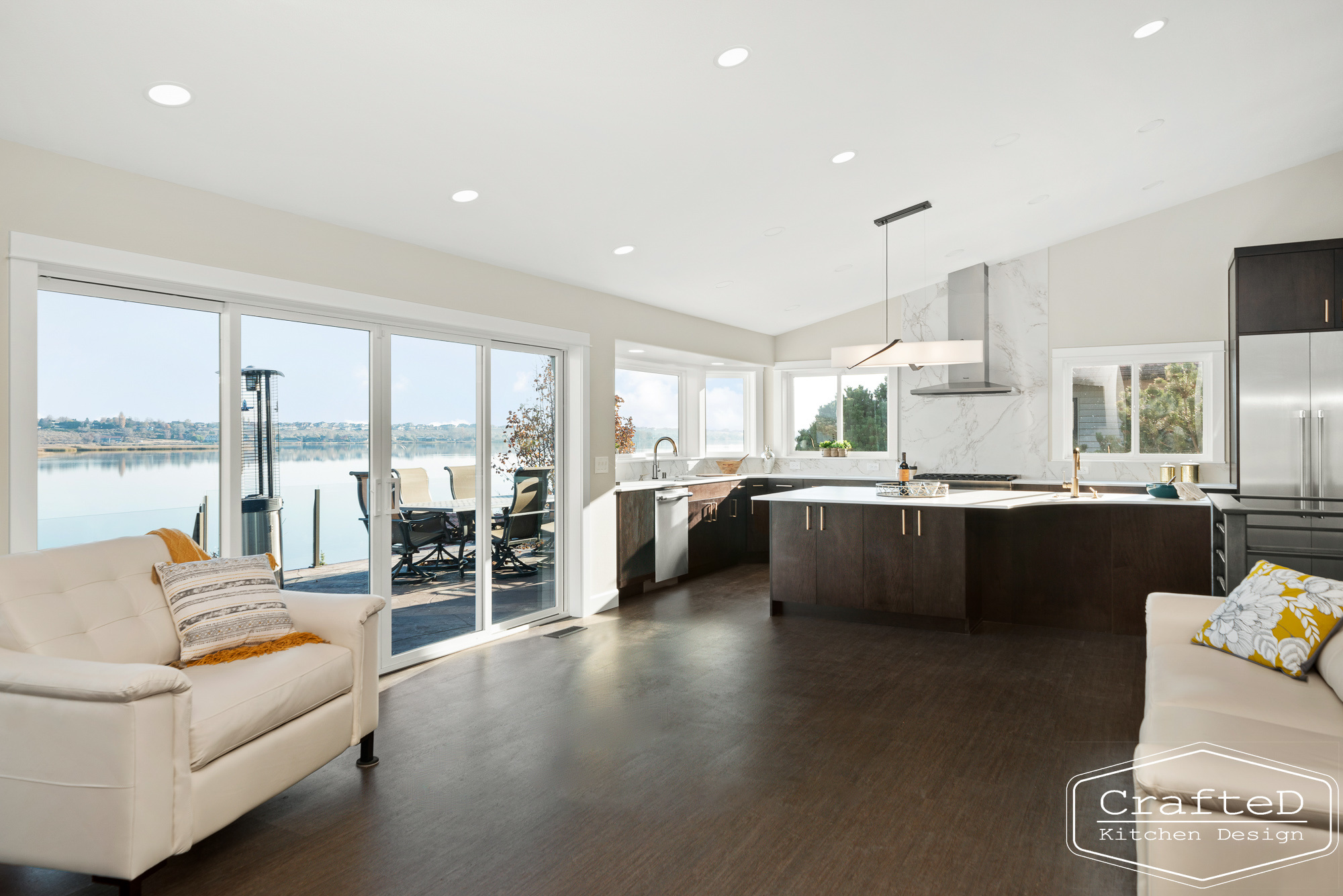 modern metropolitan kitchen design with dark toned wood cabinets, dekton marble backsplash and gold accents in spokane Coeur d'alene moses lake home renovation