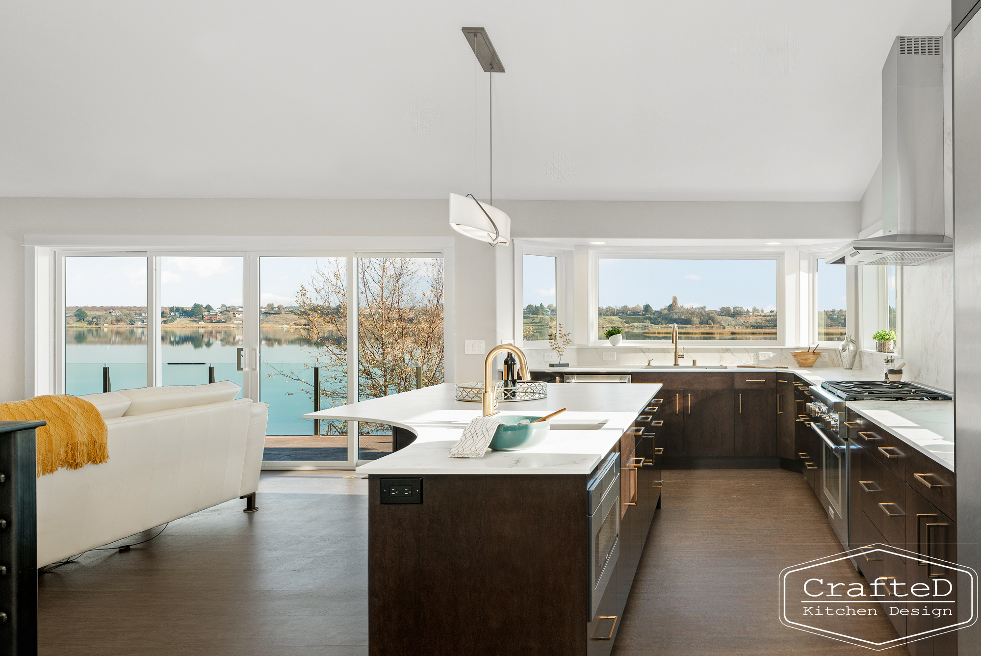 modern metropolitan kitchen design with dark toned wood cabinets, dekton marble backsplash and gold accents in spokane Coeur d'alene moses lake home renovation