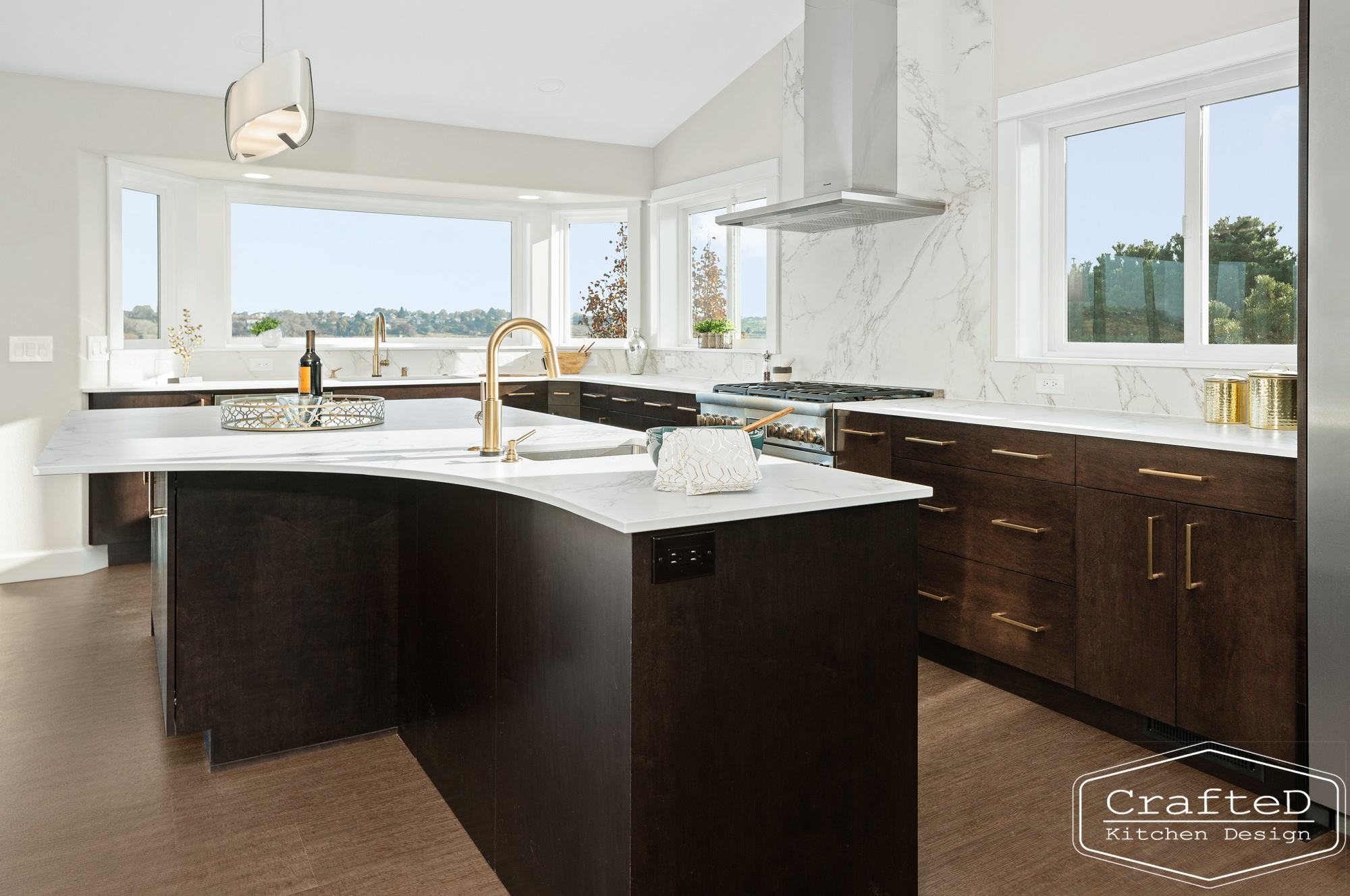 modern metropolitan kitchen design with dark toned wood cabinets, dekton marble backsplash and gold accents in spokane Coeur d'alene moses lake home renovation