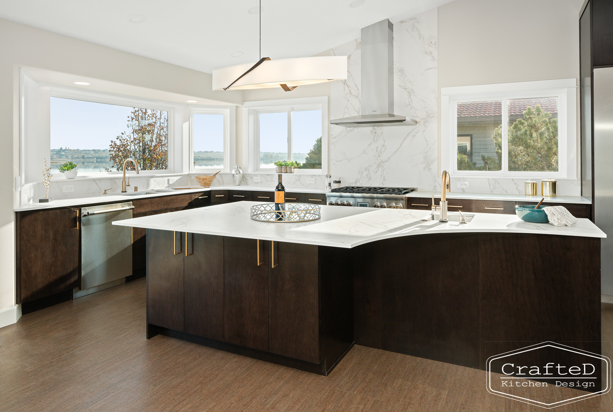 modern metropolitan kitchen design with dark toned wood cabinets, dekton marble backsplash and gold accents in spokane Coeur d'alene moses lake home renovation