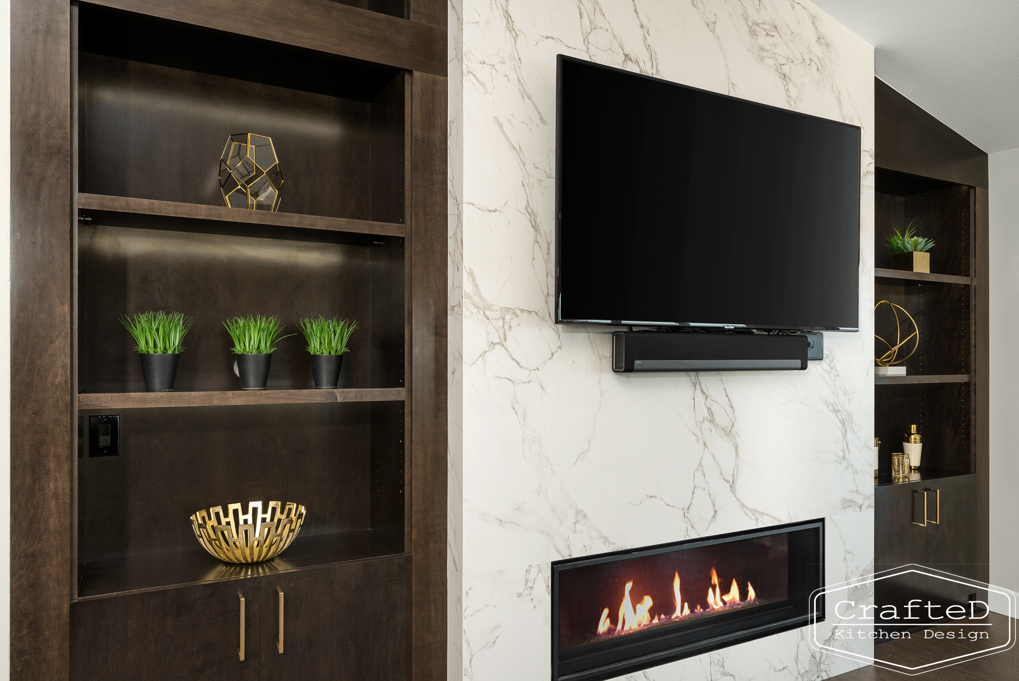 modern metropolitan fireplace design with dark toned wood cabinets, dekton marble backsplash and gold accents in spokane Coeur d'alene moses lake home renovation