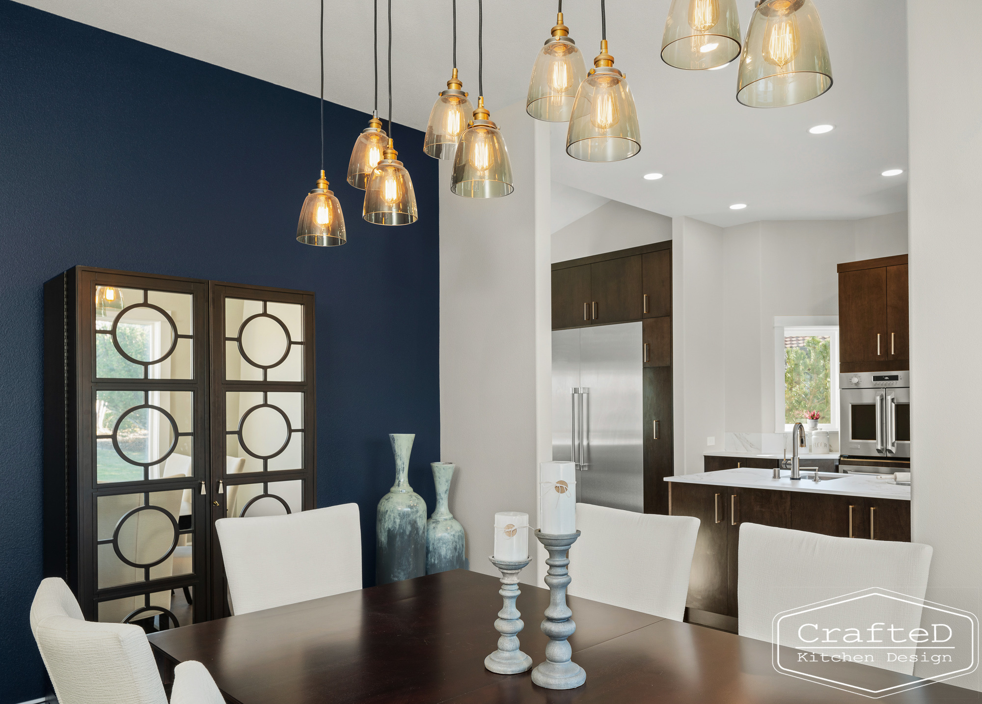 modern metropolitan kitchen design with dark toned wood cabinets, dekton marble backsplash and gold accents in spokane Coeur d'alene moses lake home renovation