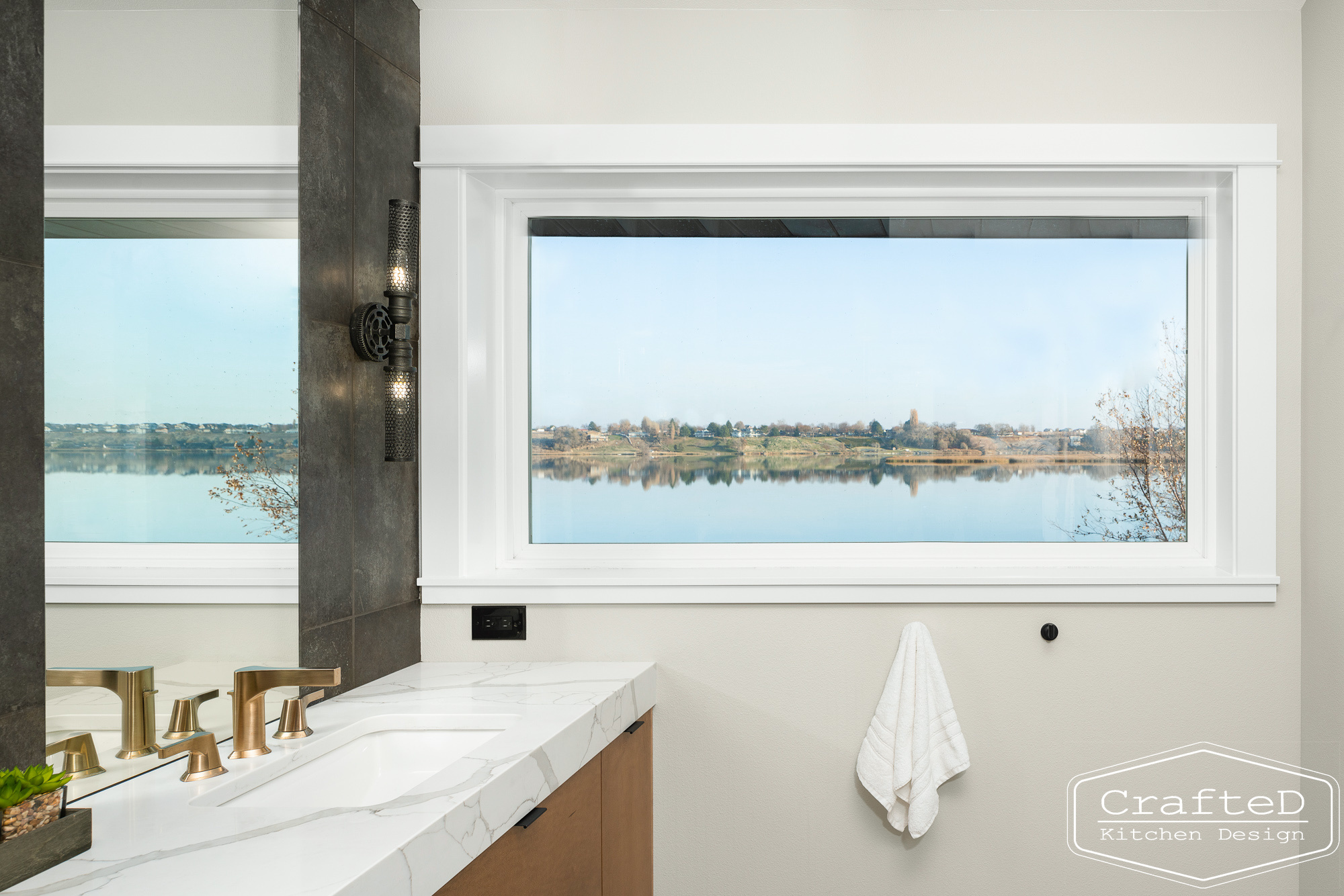 modern metropolitan bathroom design with dark toned wood cabinets, dekton marble backsplash and gold accents in spokane Coeur d'alene moses lake home renovation with amazing views