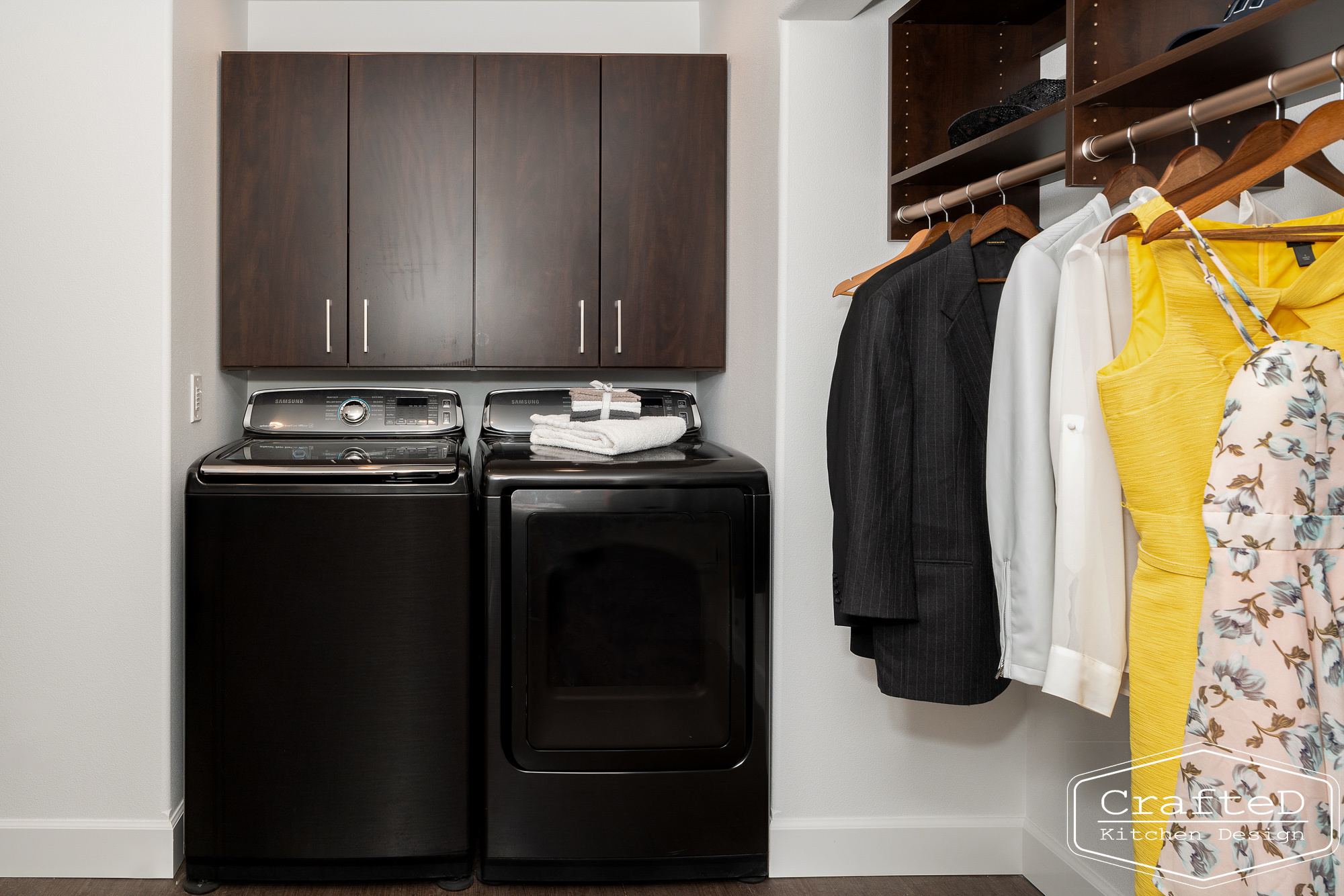 modern metropolitan bcustom closet design with dark toned wood cabinets, dekton marble backsplash and gold accents in spokane Coeur d'alene moses lake home renovation with laundry