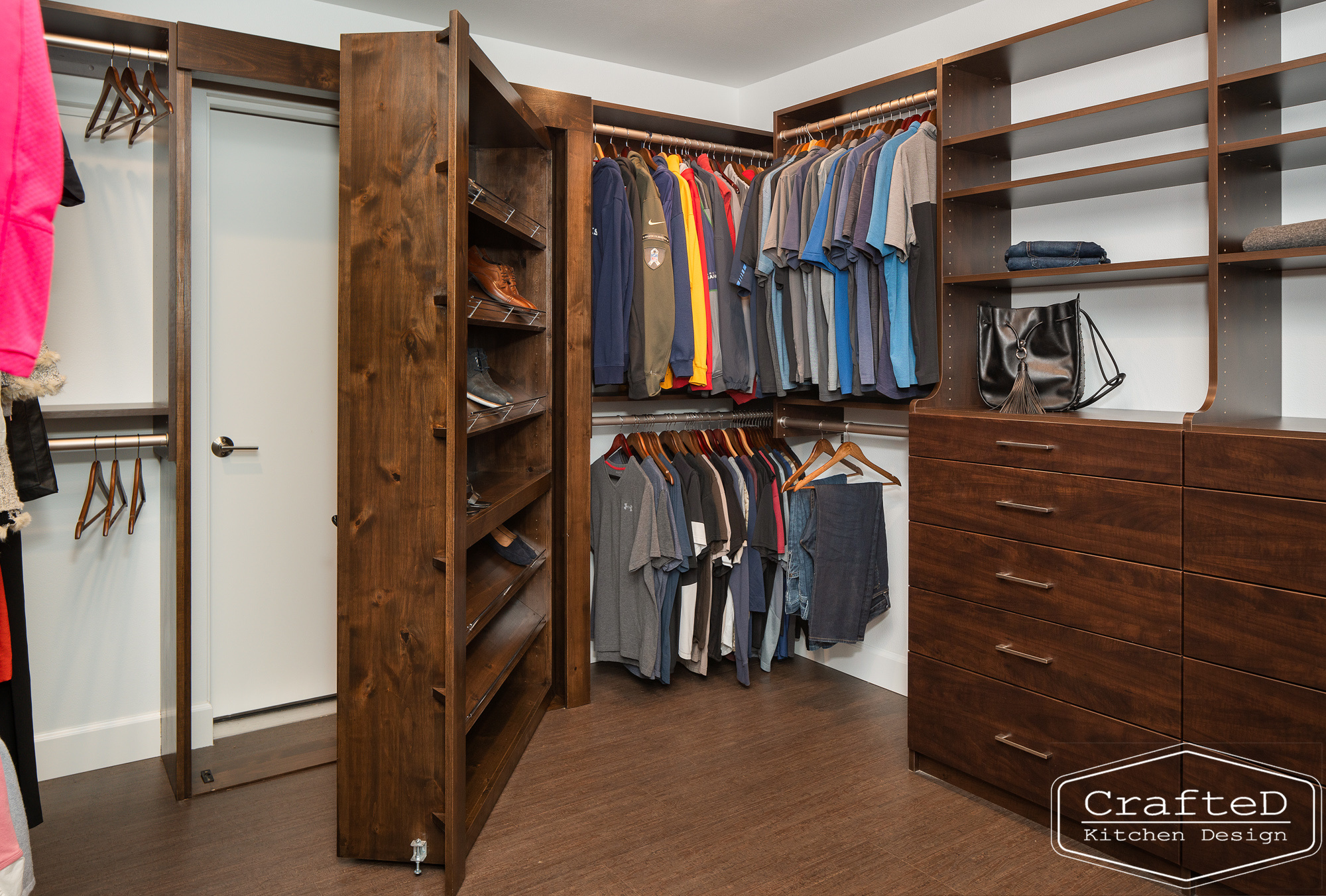 modern metropolitan bcustom closet design with dark toned wood cabinets, dekton marble backsplash and gold accents in spokane Coeur d'alene moses lake home renovation with secret door