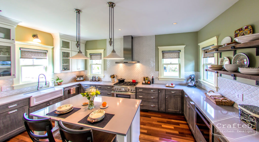 traditional kitchen design with large island hardwood floors and mosaic arabesque backsplash to ceiling