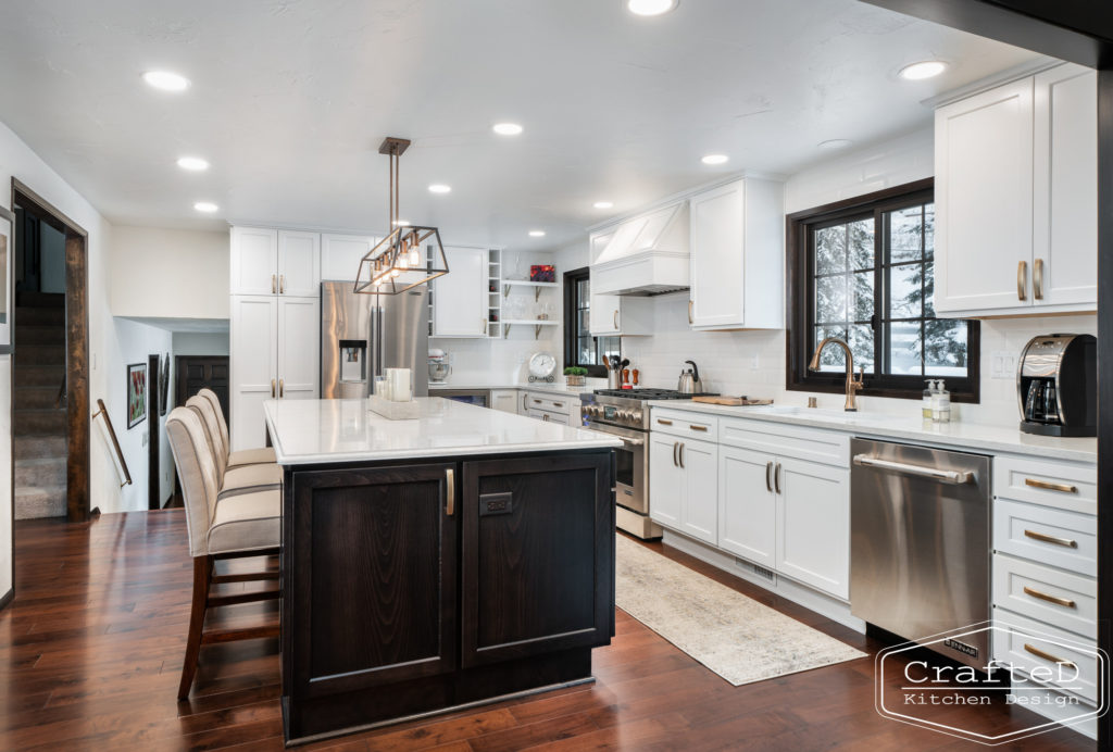 Large kitchen inspiration for split level home renovation, black and white and brown kitchen cabinets with gold hardware