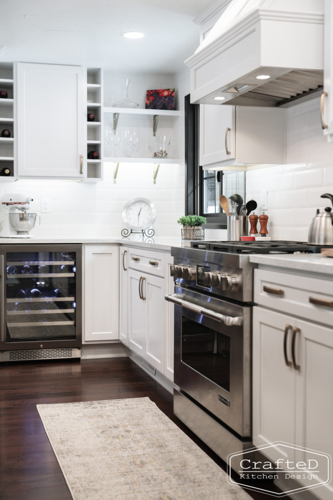 Large kitchen inspiration for split level home renovation, black and white and brown kitchen cabinets with black accents and gold hardware