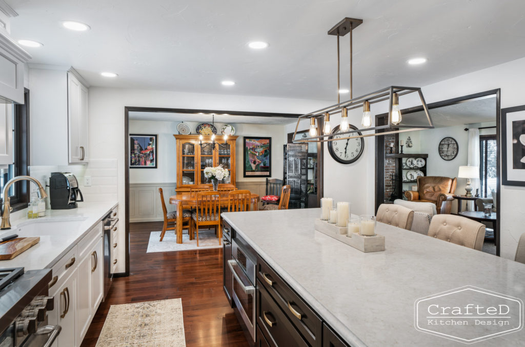 Large kitchen inspiration for split level home renovation, black and white and brown kitchen cabinets with black accents and gold hardware