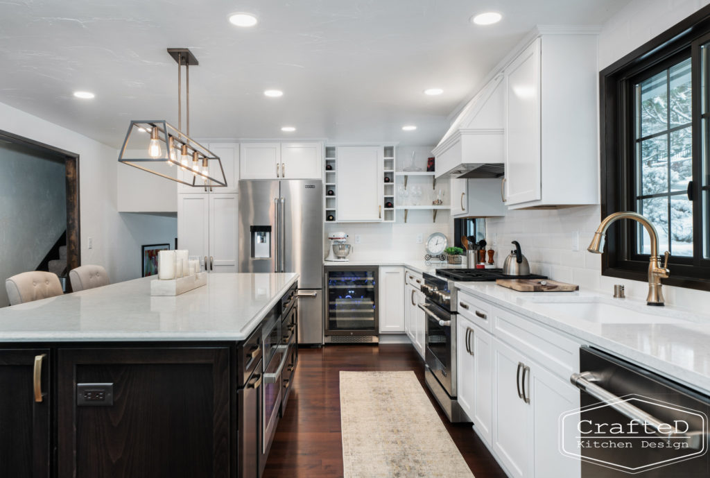 Large kitchen inspiration for split level home renovation, black and white and brown kitchen cabinets with gold hardware