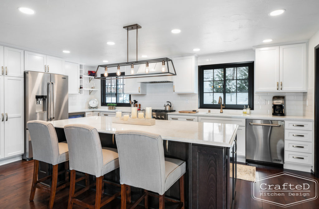 Large kitchen inspiration for split level home renovation, black and white and brown kitchen cabinets with gold hardware