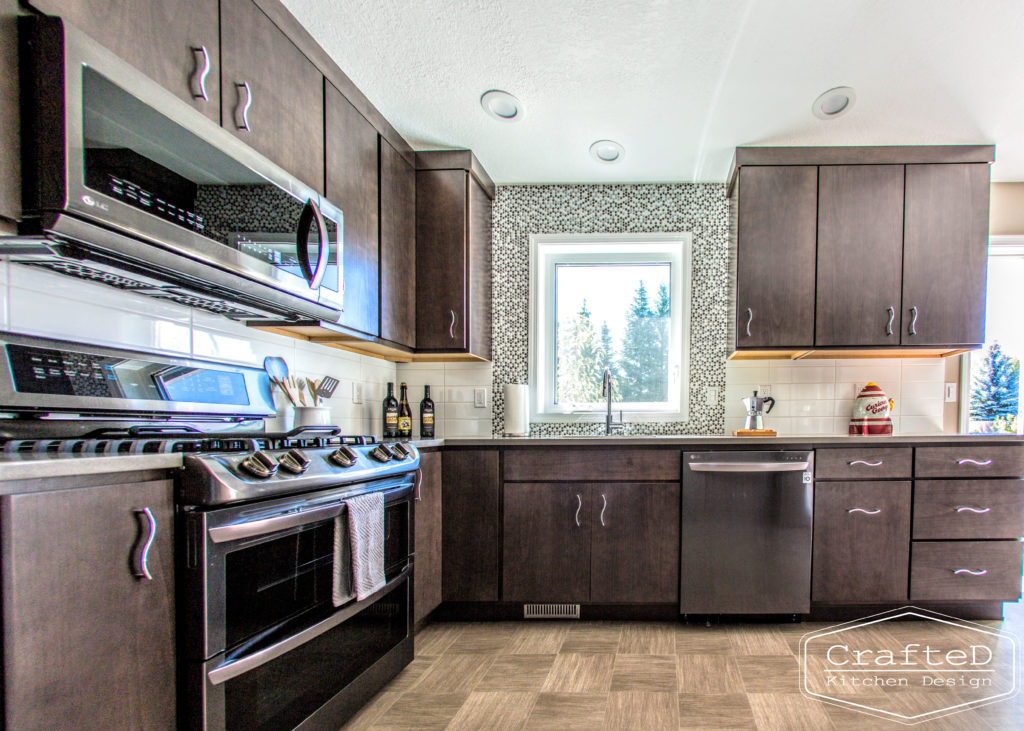 dark wood kitchen cabinets with lvp flooring and penny tile backsplash design