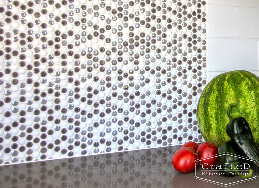 dark wood kitchen cabinets with lvp flooring and penny tile backsplash design