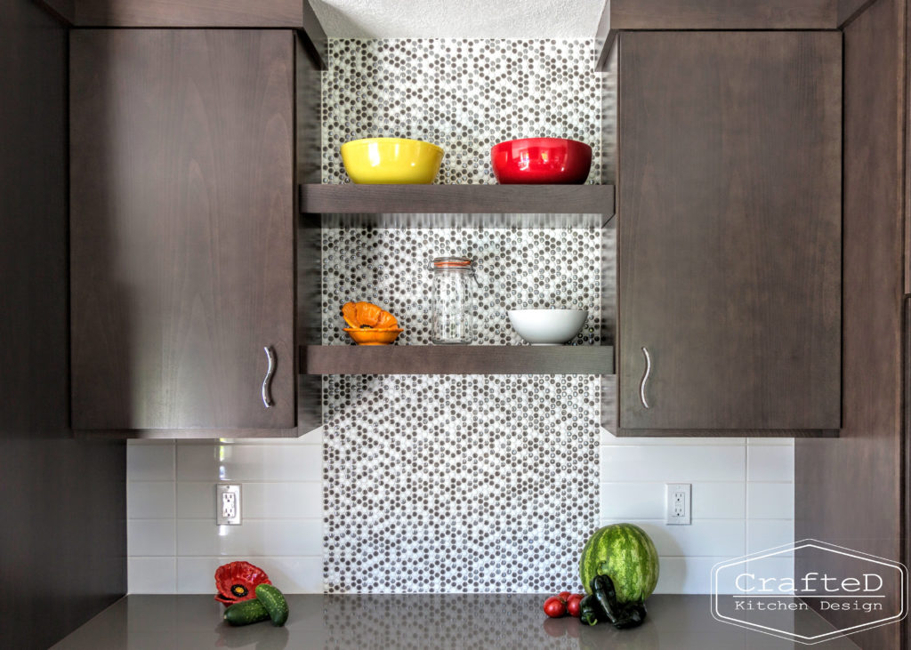 dark wood kitchen cabinets with lvp flooring and penny tile backsplash design