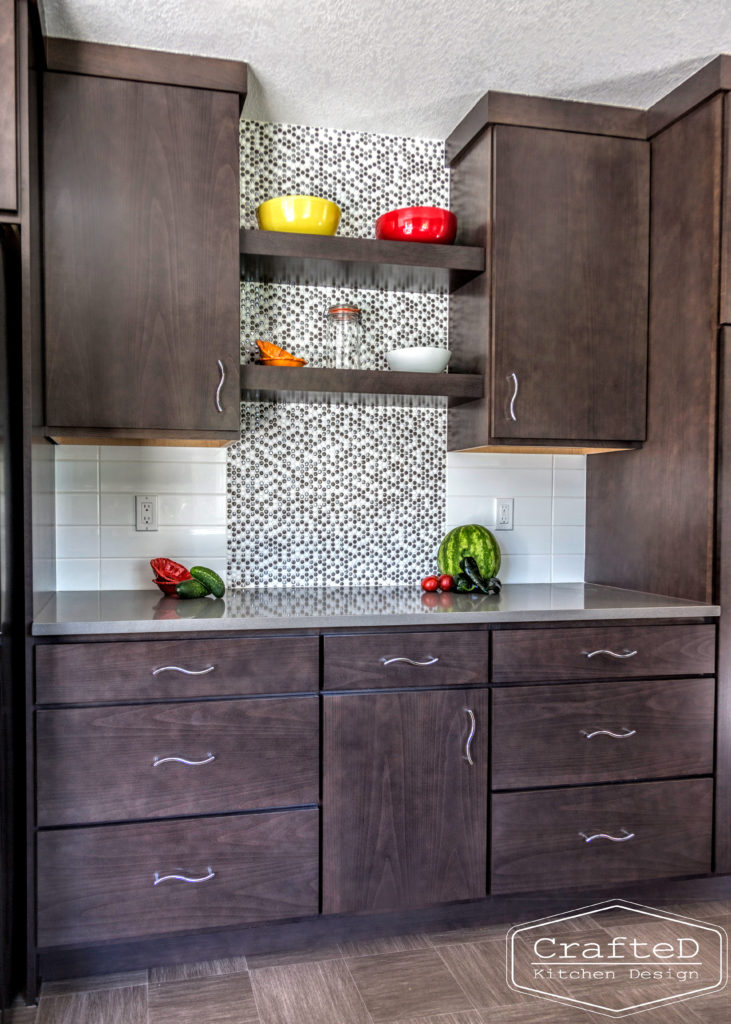 dark wood kitchen cabinets with lvp flooring and penny tile backsplash design