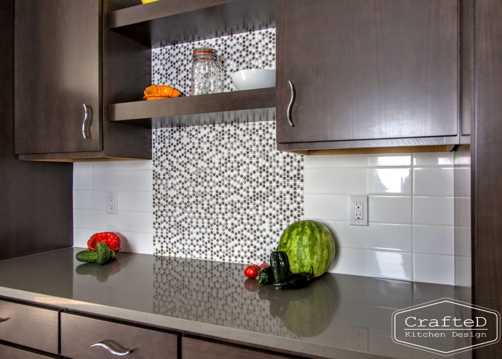 dark wood kitchen cabinets with lvp flooring and penny tile backsplash design