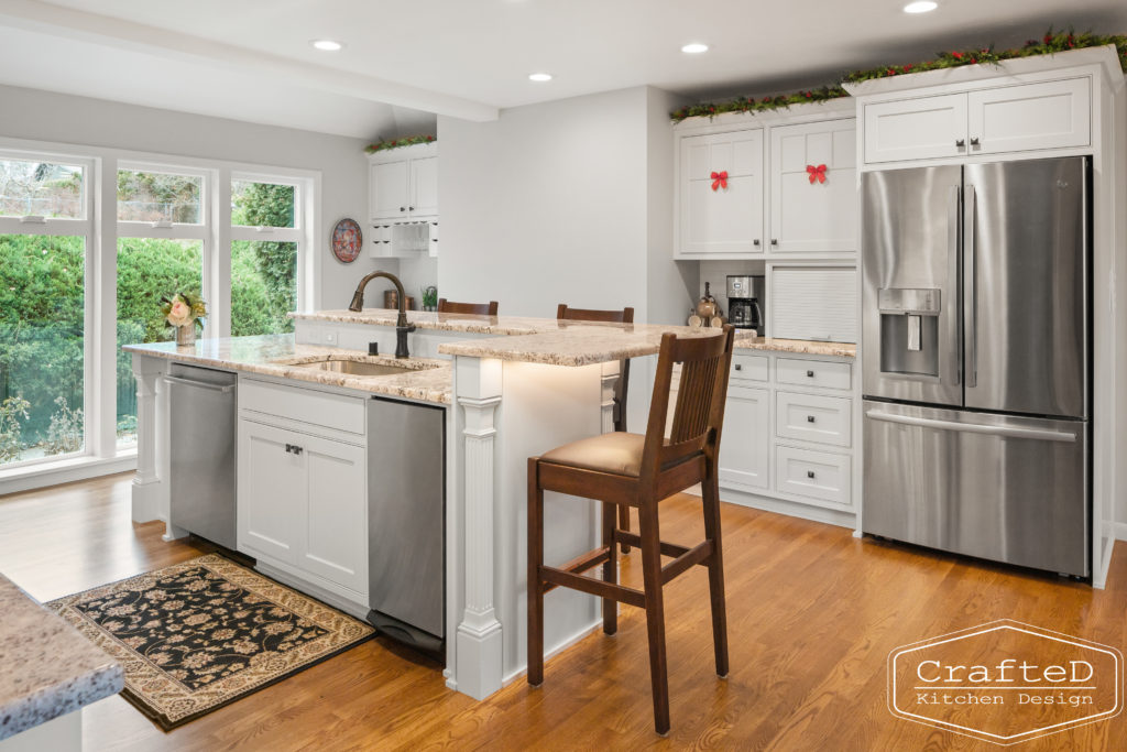 traditional white kitchen with island and coffee bar station and wine bar and built in hutch