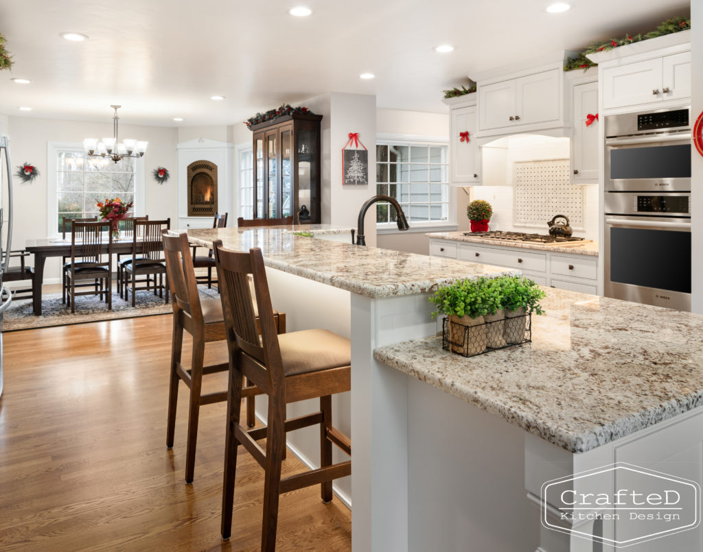 traditional white kitchen with island and coffee bar station and wine bar and built in hutch